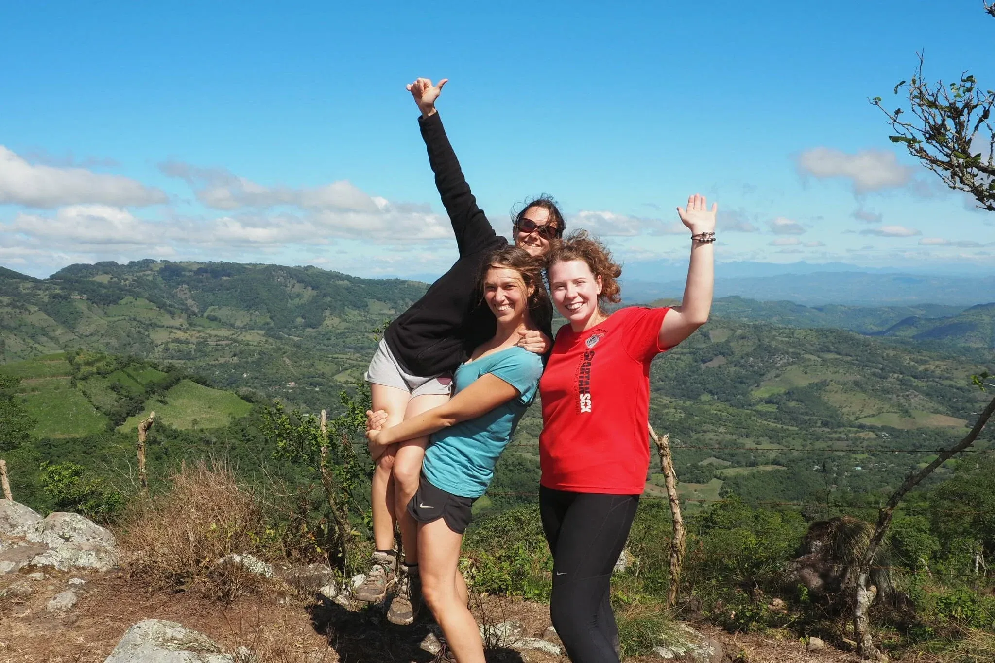My co-PMs, without whom I would not have survived. This picture was taken on day three of the trek, on the top of the first real mountain. We still look very white, and very clean!