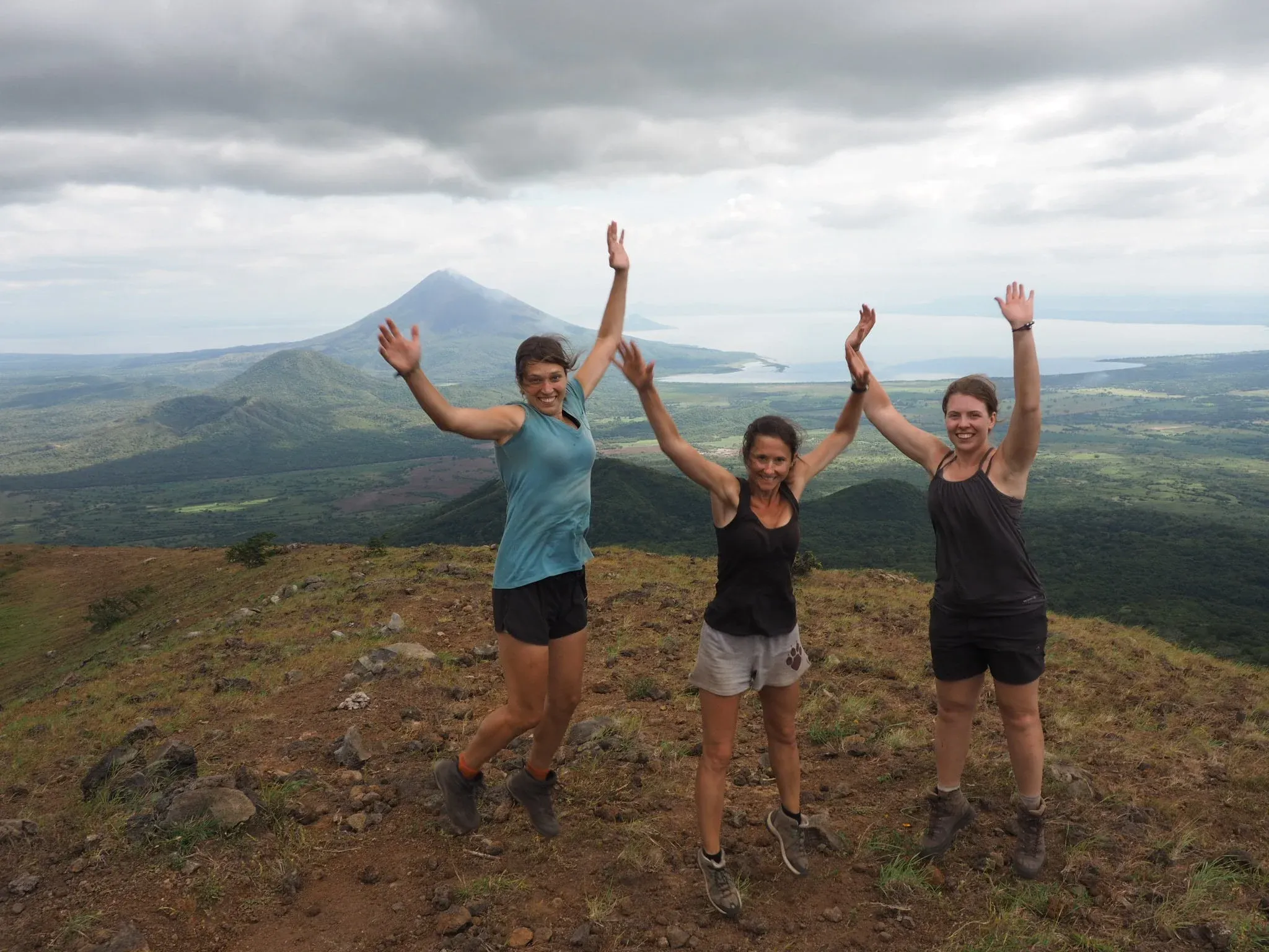 Day 14 of trek, on the top of the final mountain, still wearing the same clothes. Not sure what is tan and what is dirt. We look awkwardly photoshopped, but I assure you, we&#x27;re not.